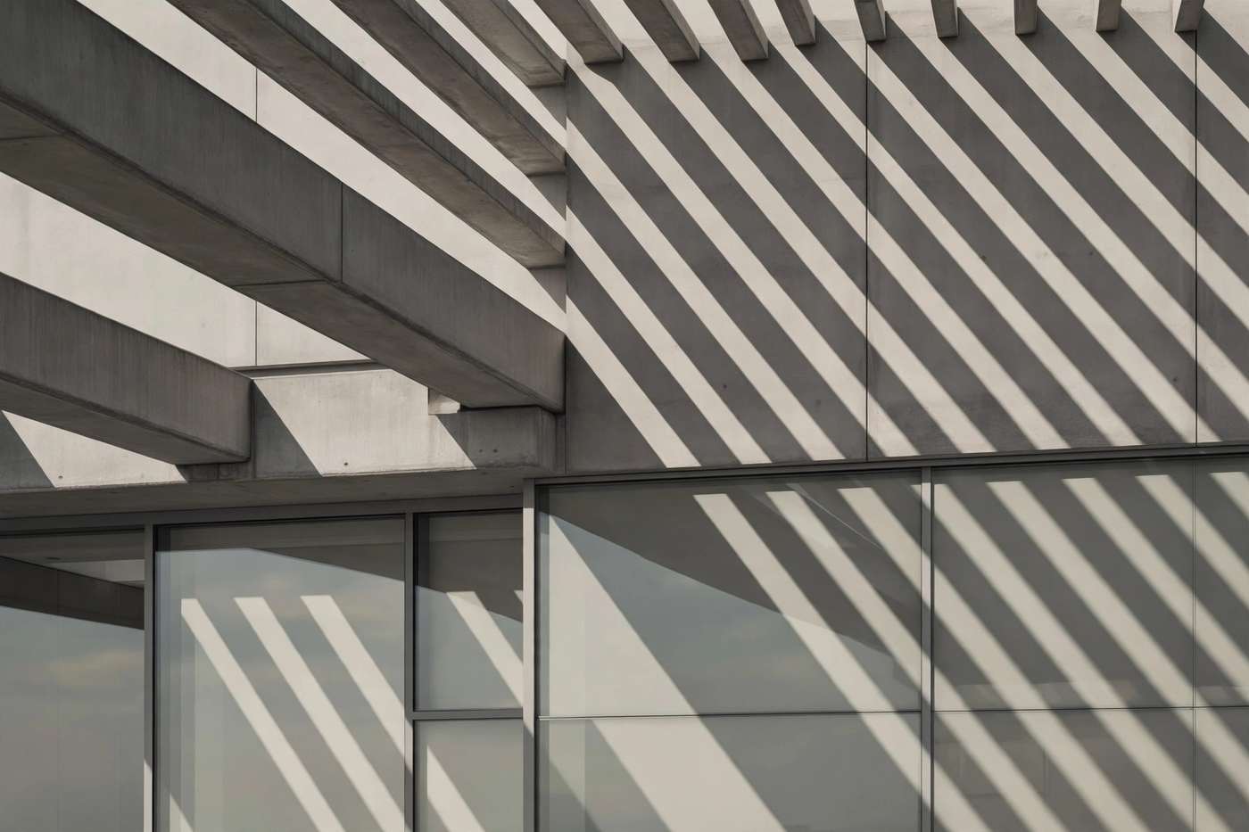 Concrete and glass architectural detail, desaturated